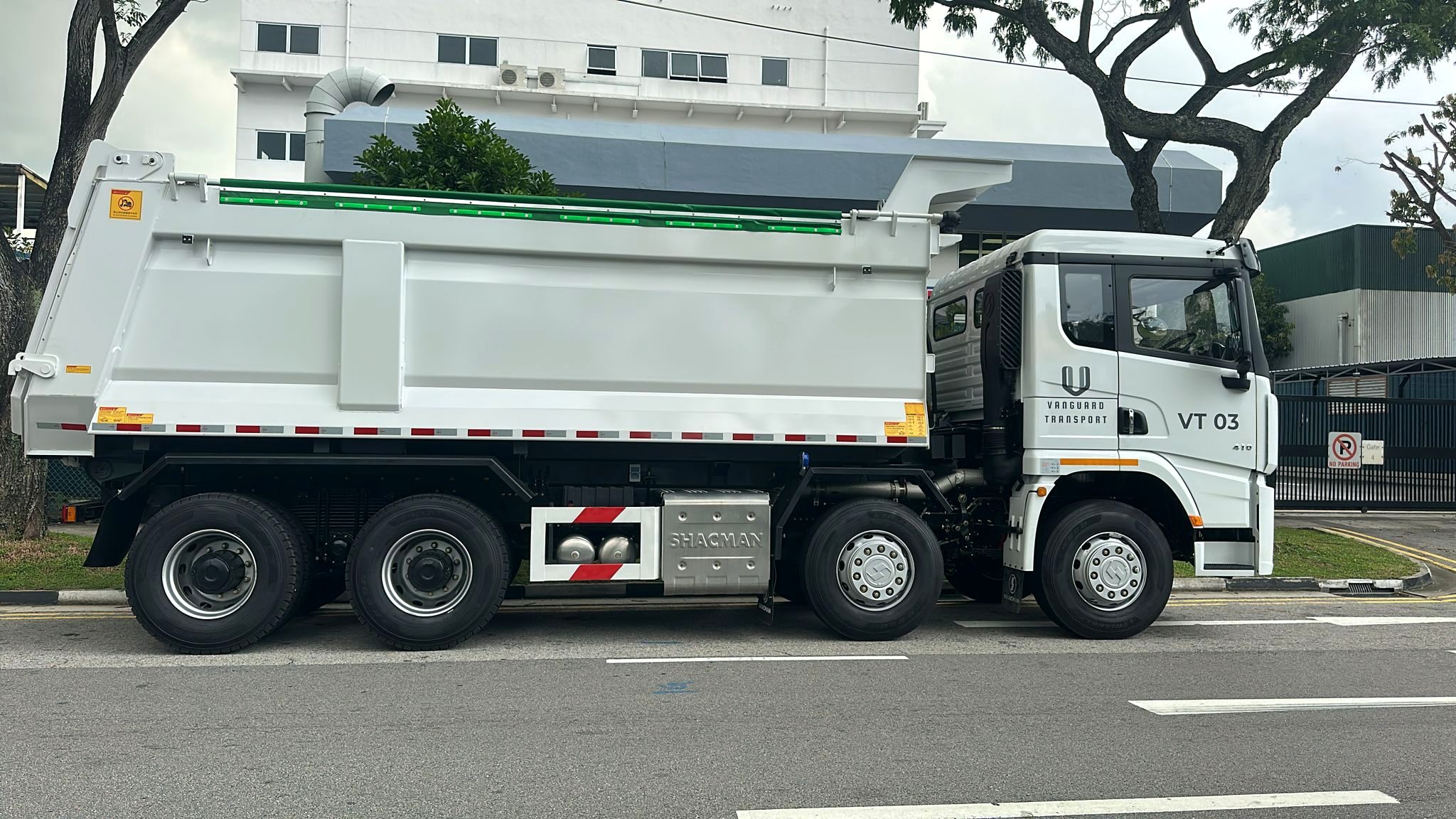 Vanguard Transport branded tipper truck VT03 on a Singapore road